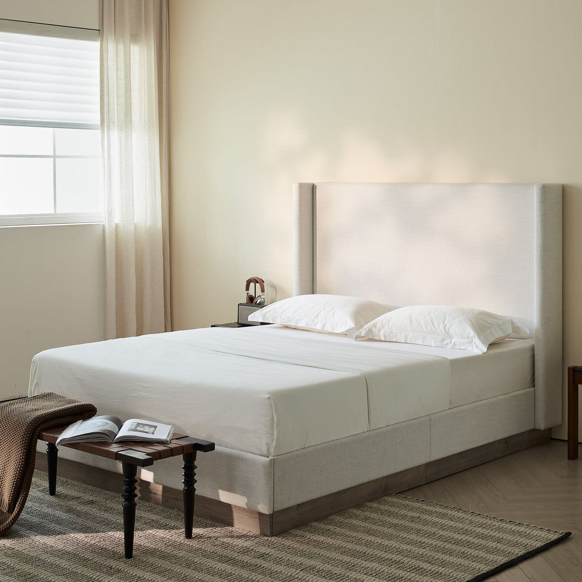 Hosford Minimalist Upholstered Wingback Bed With Rustic Wood Base