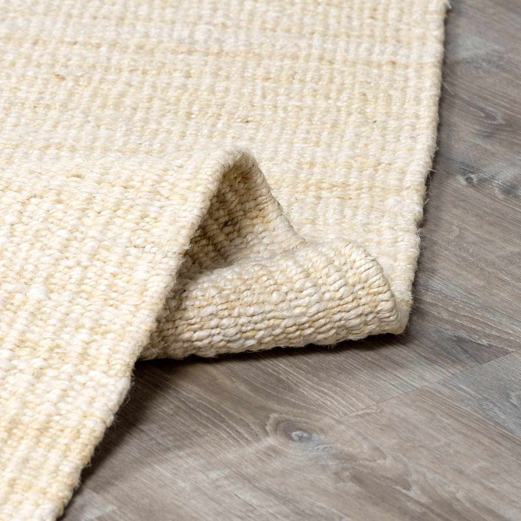 Iantha Handmade Ivory Jute Rug With Custom Shape And Fringe