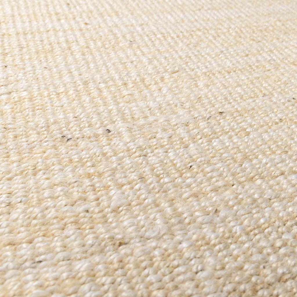 Iantha Handmade Ivory Jute Rug With Custom Shape And Fringe