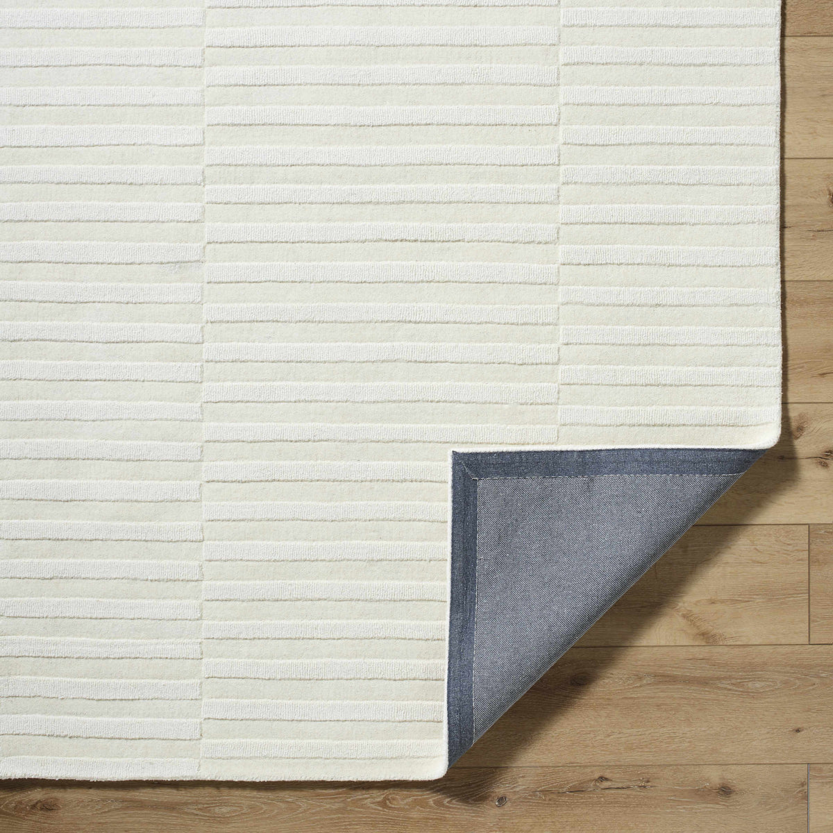 Aelius Hand Loomed Pure Wool Rug In Soft Cream Hues