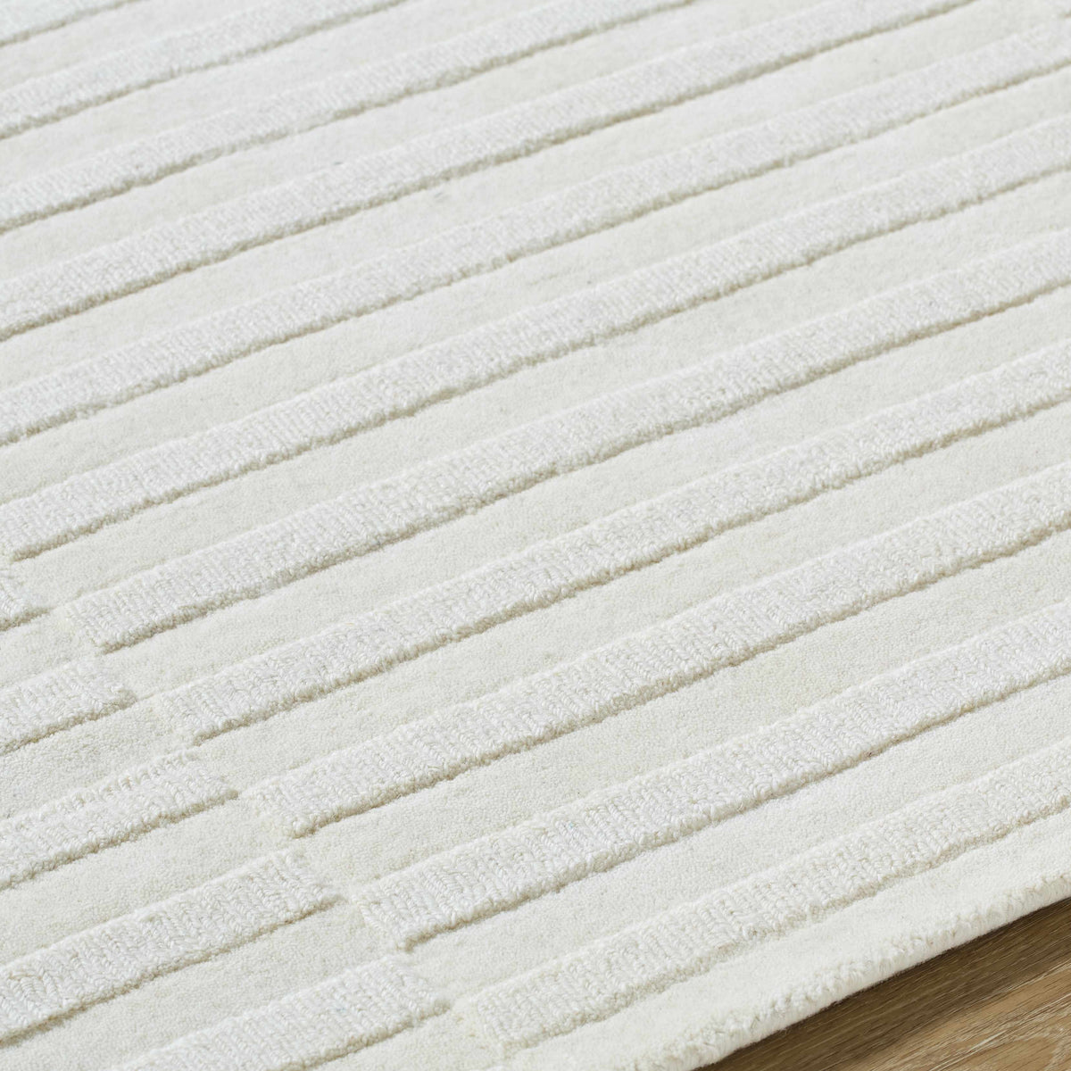 Aelius Hand Loomed Pure Wool Rug In Soft Cream Hues