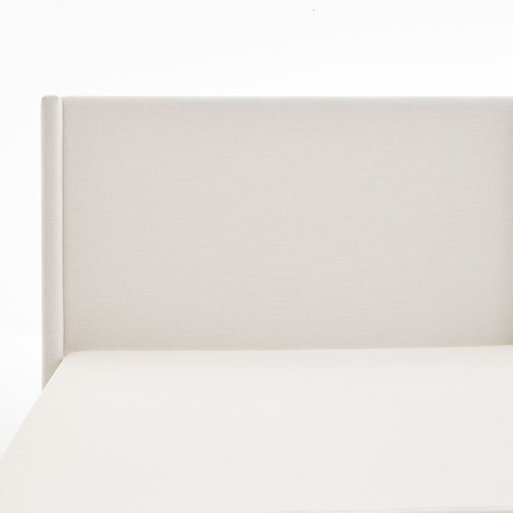 Hosford Minimalist Upholstered Wingback Bed With Rustic Wood Base